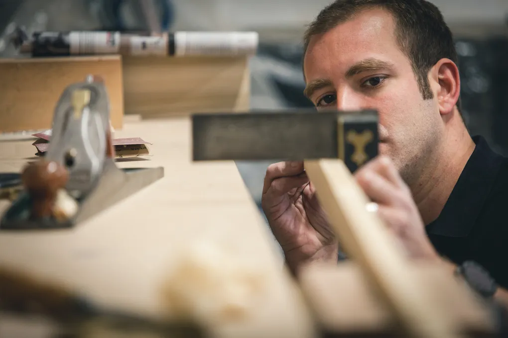 James Reeve checking a joint in the workshop