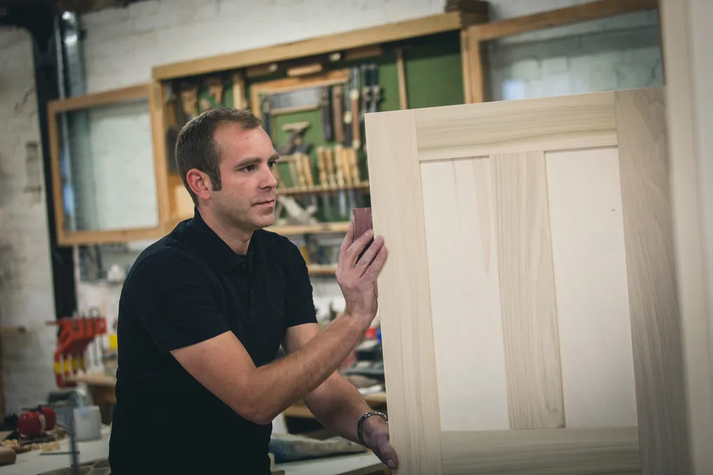 James Reeve with a cabinet door